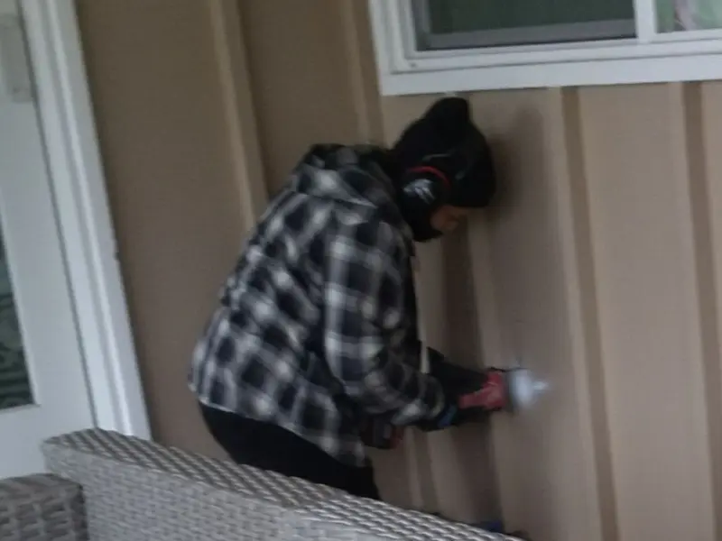 Professional electrician installing an exterior outlet in Middlebury